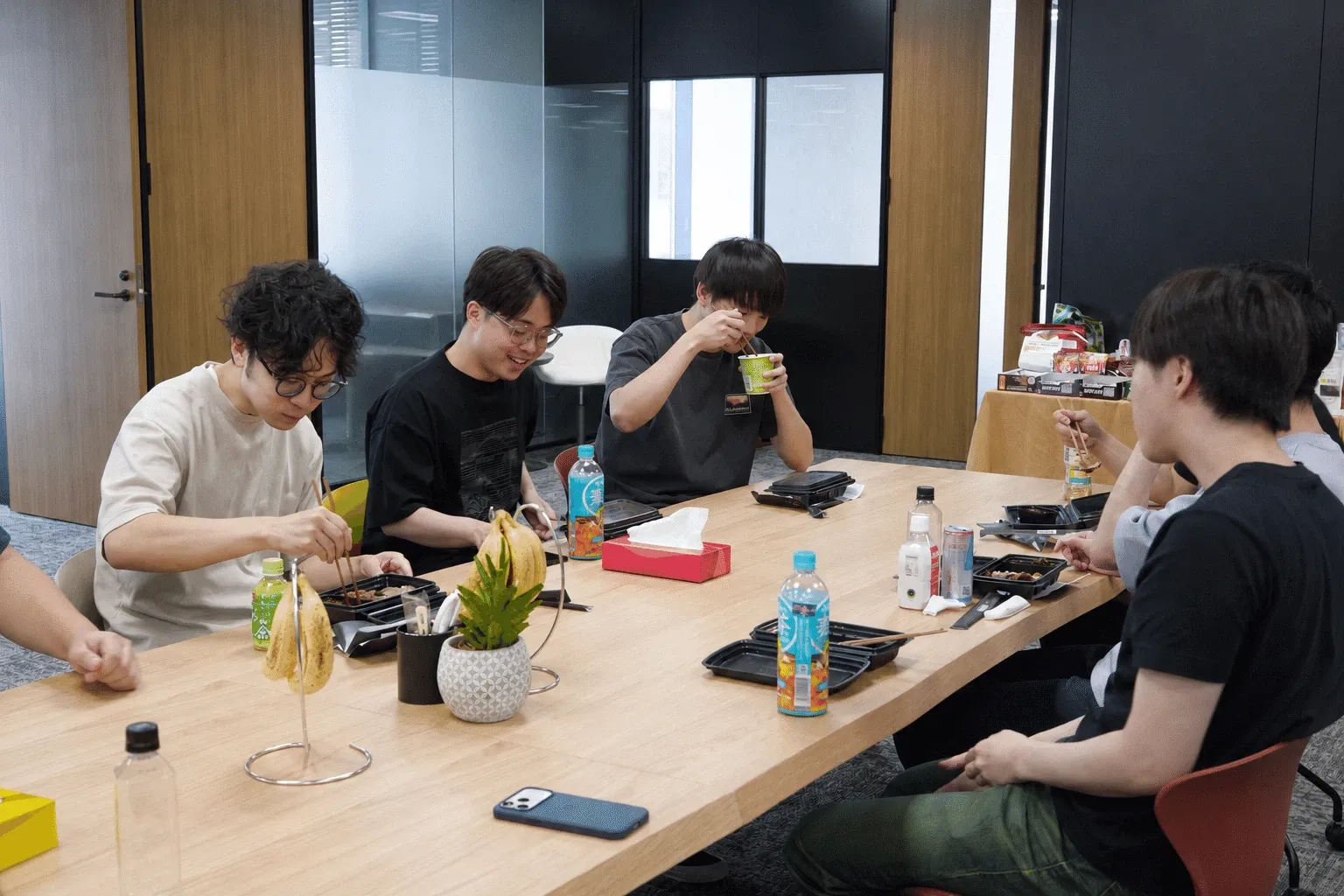 The team working around a large table